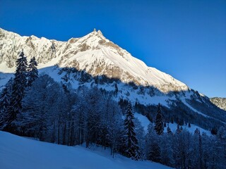 Beautiful Skitour in the swiss mountains. Ski mountaineering. View of the mountain fluebrig and turner. Winter landscape