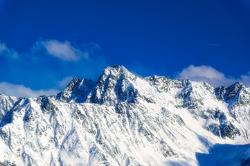 Austrian Alps mountain peaks covered with snow during winter time.