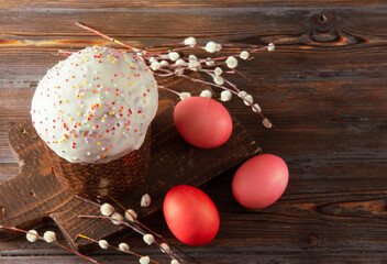 Easter cake with red eggs and willow branches