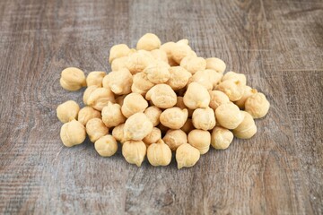 A small pile of raw white quinoa on the desk