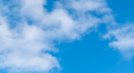 Light soft white clouds in a gently blue sky