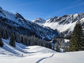 Fototapeta na wymiar ski touring trail on the mountain mutteristock in Switzerland. Beautiful slope in deep snow. Ski mountaineering, skimo