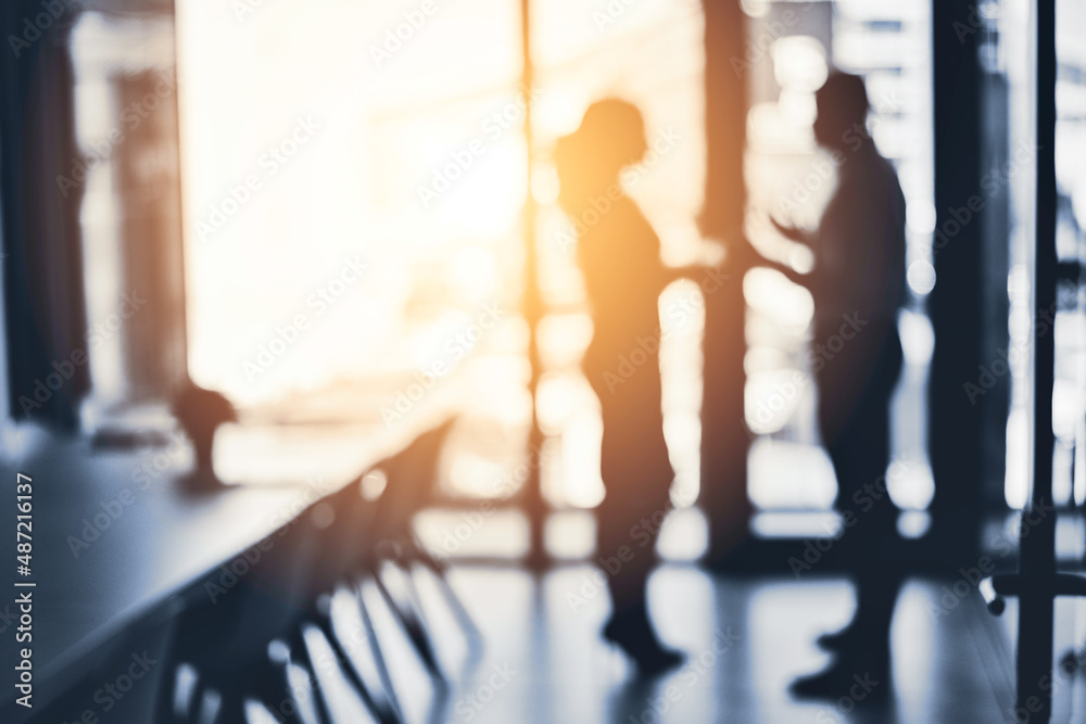 Aufkleber teaming up to push through towards great success. defocused shot of two businesspeople having a disc