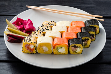 Sushi roll set in restaurant served in white plate Japan cuisine