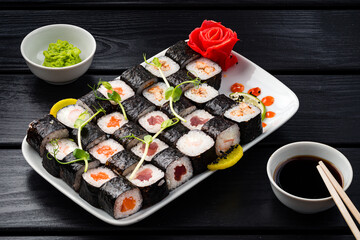 Classic Japanese sushi roll hosomaki with tuna, salmon and shrimp