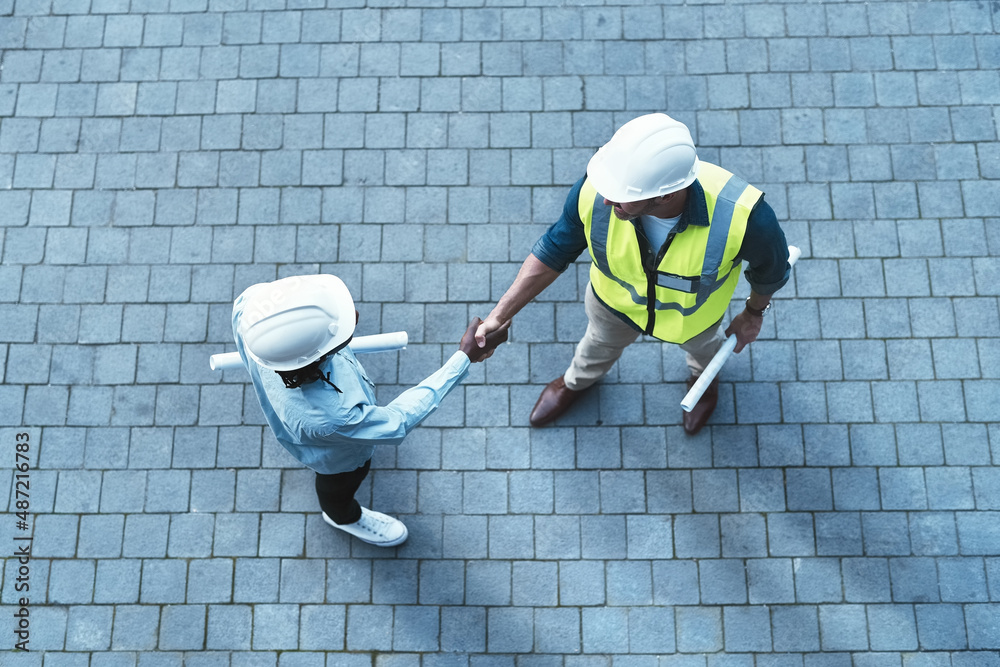 Aufkleber I cant wait to start this project with you. Shot of two engineers shaking hands.