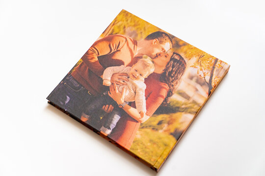 cover of a photobook from a family photo shoot. 