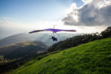 Hang Gliding launching from mountain top, adventure sport. Brazil