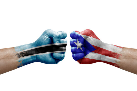 Two hands punch to each others on white background. Country flags painted fists, conflict crisis concept between botswana and puerto rico