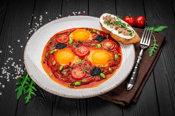 Shakshuka eggs with black caviar