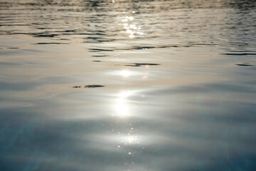 Closeup surface of blue clear water with small ripple waves in swimming pool