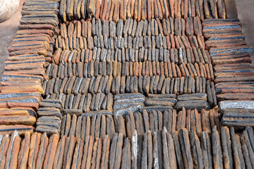 Various colored decorative relief cladding slabs natural looking artificial stones. Colorful natural stone - Rock texture and slate stone. In post-production warehouse