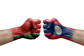 Two hands punch to each others on white background. Country flags painted fists, conflict crisis concept between belarus and laos