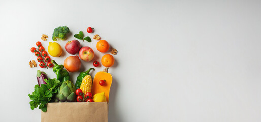 Delivery healthy food background. Healthy vegan vegetarian food in paper bag vegetables and fruits...