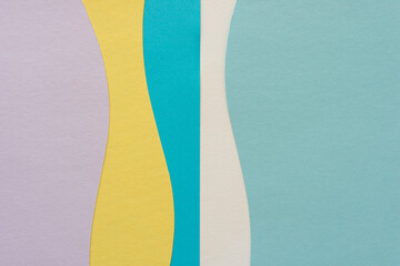 paper design suitable as a background with blank space featuring undulating lines in mauve, yellow, and blue