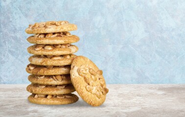 Peanut butter cookies stack on wooden board. Traditional american dessert, nutrition snack, dessert or breakfast food.