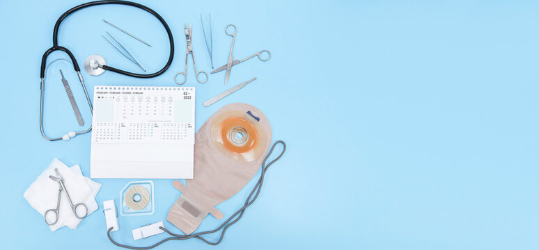 Surgeon's set: from a colostomy bag, surgical instruments, a stethoscope, bandages and calendar 2022.
