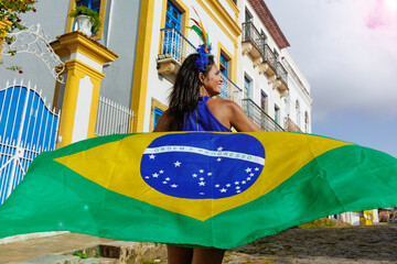 Beautiful Woman fun of the Brazilian soccer team celebrating in the street. Dressed in the colors of Brazil.