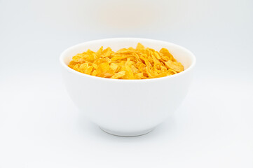Corn Flakes, in a white bowl, isolated on a white background