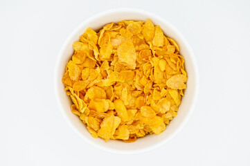 Corn Flakes, in a white bowl, isolated on a white background