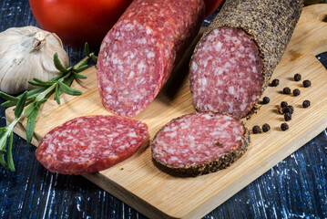 Sliced salami on cutting board