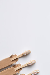 Set of ECO friendly wooden bamboo toothbrushes. Save the planet or NO plastic concept. Isolated on white background.