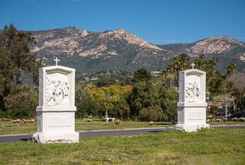 Santa Barbara, California, USA - February 8, 2022: Calvary Cemetery. Landscape with white statues...