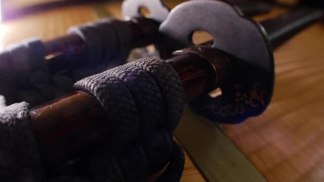 Samurai swords being drawn on tatami
