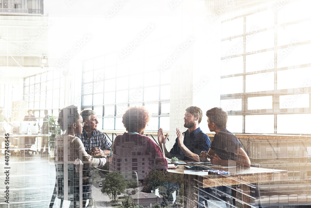 Poster collaborating to build the city of their dreams. multiple exposure shot of businesspeople having a m