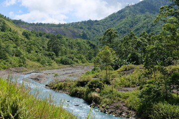 Fototapeta na wymiar A winding river waterway at Panguna copper and gold min in the Autonomous Region of Bougainville, Papua New Guinea