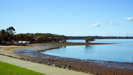 Tranquil scene looking across the water from Victoria Point to Coochiemudlo Island  at low tide. Queensland, Australia 