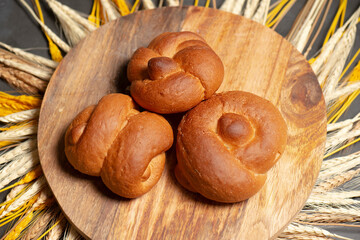 Delicious fresh baked crusty style knot bread rolls in assorted shapes including double knot and...