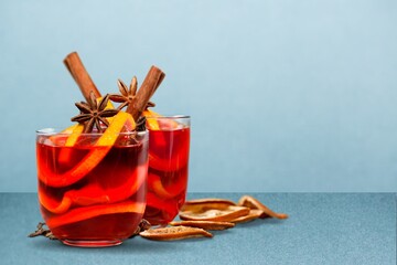 Apple cider with slices, cinnamon and anise stars in transparent cups. Seasonal apple mulled wine