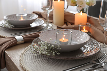 Festive table setting with beautiful floral decor in restaurant