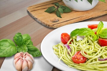 Classic italian pasta pesto with pound garlic, basil leaves, hard parmesan cheese