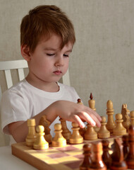 little child playing chess