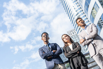 Group of business people.Business people meeting talking and sharing their ideas in city. Business team and teamwork concept. Business people standing outside in the city discussing about new project.