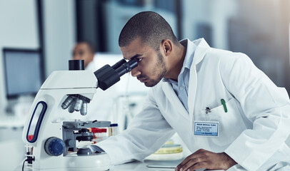 Success never rests, neither do diseases. Cropped shot of a young male scientist working in his lab. © Thurstan Hinrichsen/peopleimages.com