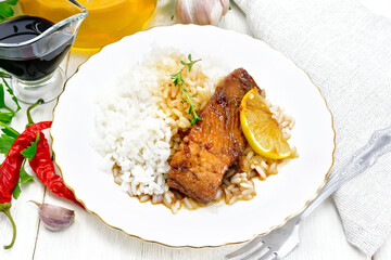 Salmon with sauce in plate on white board