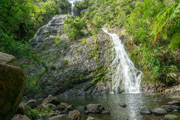 Waihirere falls tumble down sheer rock face into pool 