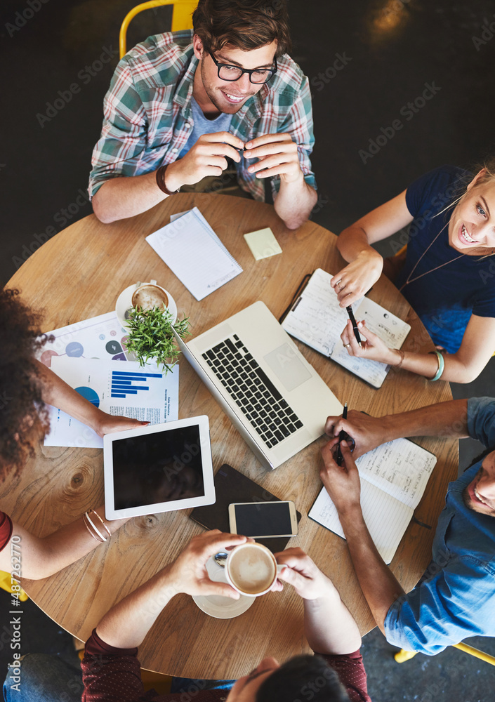 Poster we have all the information we need to pass exams. high angle shot of a group of students studying i