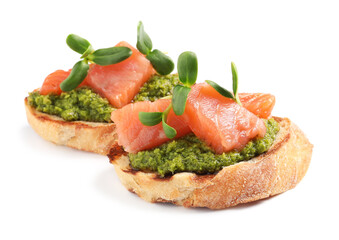 Delicious bruschettas with salmon, pesto sauce and microgreens on white background