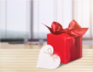 Red gift or present box with red bow