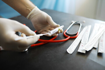 Medical background. PCR test for covid. Cotton swabs for taking a smear on the table.