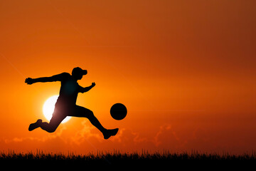 Fototapeta na wymiar silhouette of a child playing football