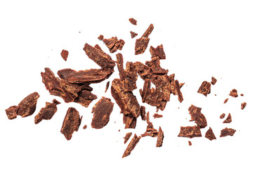 Grated Chocolate pieces isolated on white background. Crushed dark chocolate Top view. Flat lay.
