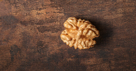 Peeled Walnut on dark vintage table. Walnuts kernels  top view, copy space.