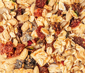 Oat flakes wallpaper with Nuts, seeds and dried fruits. Granola  Pattern.