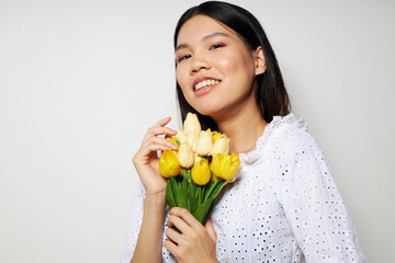 woman romance bouquet of flowers near the face studio model unaltered