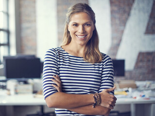 Positive things happen to positive people. Cropped shot of an attractive young designer standing in...